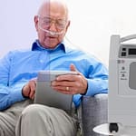 person using Evox oxygen concentrator
